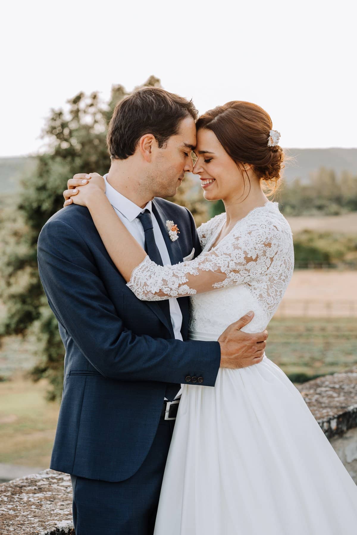 Bride and groom embracing during their couple photos at Domaines de Patras